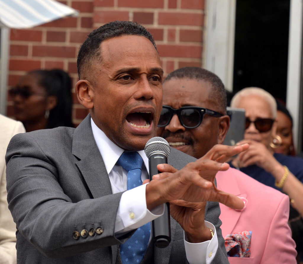 U. S. Senate Candidate Hill Harper gestures to the crowd Sunday May 26, 2024 during a campaign on the Avenue of Fashion (Livernois Ave) in Detroit, Michigan along with celebrating 100 Men in Suits organization.(Morris Richardson II/Zone 5 Photo Agency)